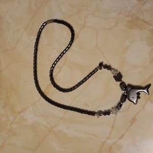 Very cute full stone Magnatite and Quartz Crystal dolphin necklace